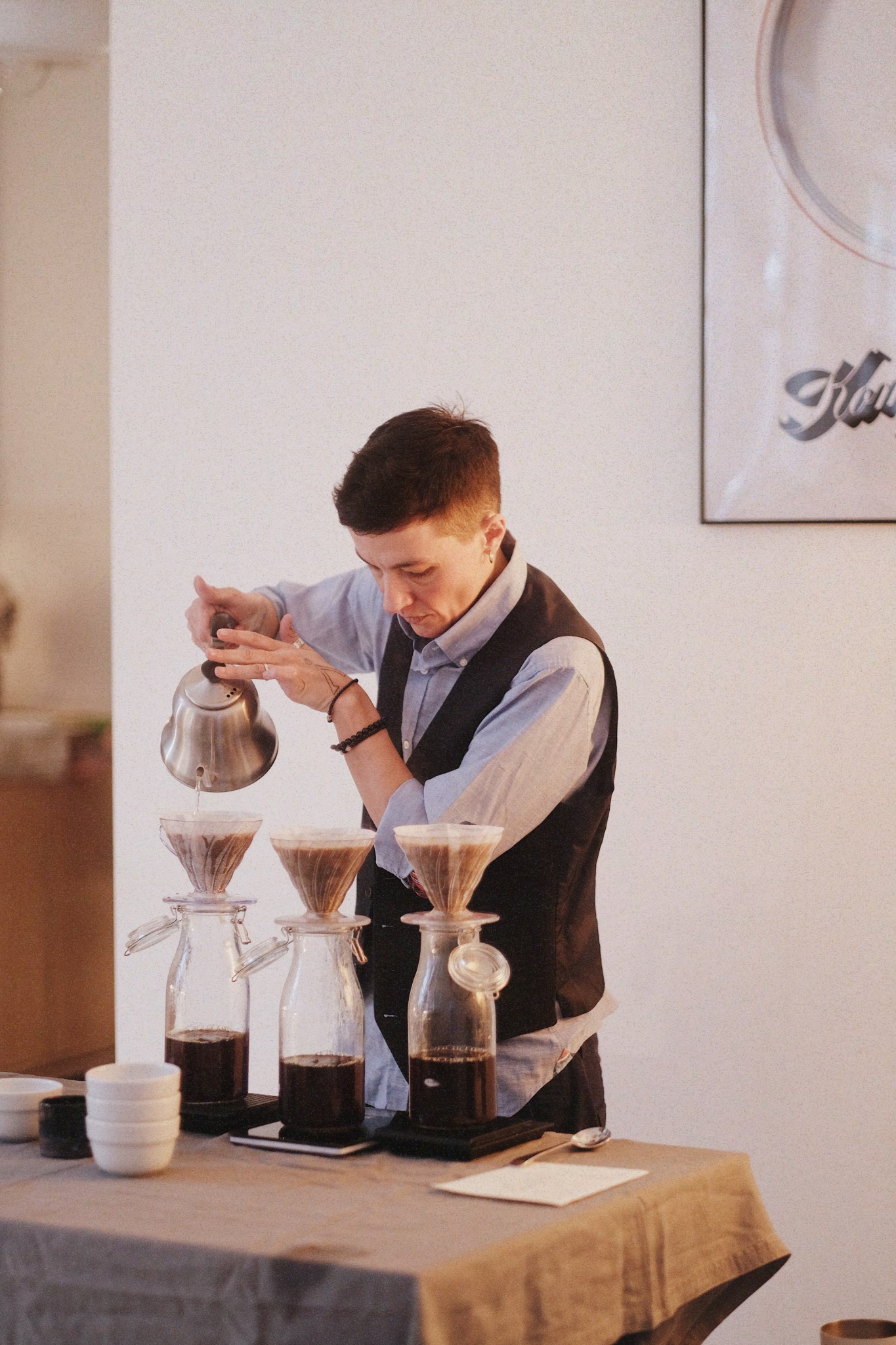 Iku preparing coffee at a tasting